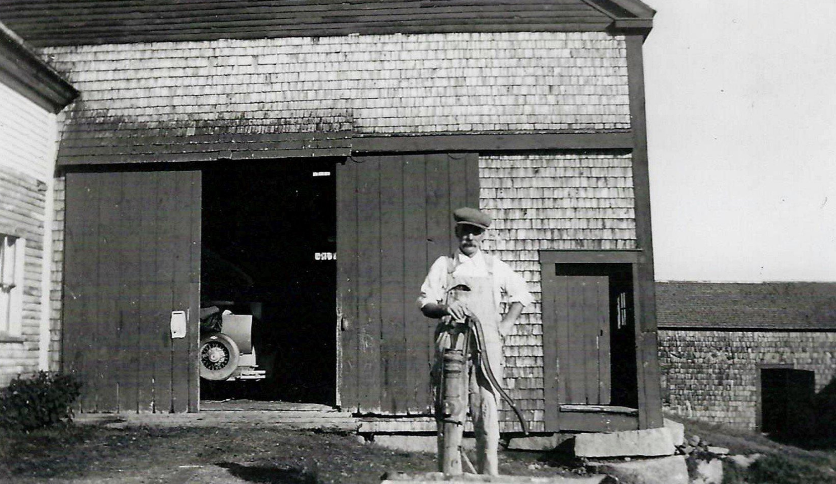 Grandfather on the farm probably in the "30's" - note the Chevy in the barn 